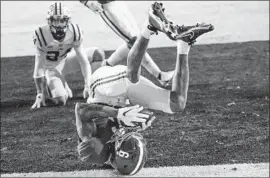  ?? Matthew Hinton Associated Press ?? ALABAMA’S DeVonta Smith makes a touchdown grab against Louisiana State’s Derek Stingley Jr. Smith had eight catches for 231 yards and three touchdowns.