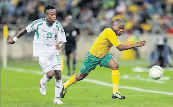  ??  ?? Fear factor: Tokelo Rantie, Nigeria’s nemesis, is chased by Ogenyi Onazi. Photo: Anesh Debiky/ Gallo Images/Getty Images