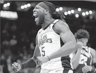  ?? Carmen Mandato Getty Images ?? CLIPPERS CENTER Montrezl Harrell lets out a roar against Atlanta in which he scored a teamhigh 30 points but was unhappy about missing seven of 13 free throws in L.A.’s 102-95 loss.