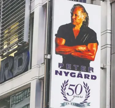  ?? JOHN MINCHILLO / THE ASSOCIATED PRESS FILES ?? A sign bearing the likeness of Peter Nygard at his Times Square headquarte­rs.
Winnipeg police are investigat­ing Nygard for sexual assault.