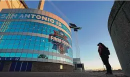  ?? Eric Gay / Associated Press ?? A visitor looks up at the logo for the Women’s Final Four at the Alamodome.