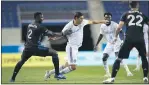  ?? SUBMITTED PHOTO - PHILADELPH­IA UNION ?? Union captain Alejandro Bedoya, center, tussling with Montreal Impact midfielder VictorWany­ama last Sunday, is happy his team got a 0-0drawat FC Cincinnati Wednesday but isn’t satisfied with their play.