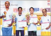  ??  ?? CHAMPIONS: From left: Shabbir Khan (veteran men), Yogesh Dhongadee (men), Kajal Kumari (women) and Shobha Kamat (veteran women) proudly pose with their trophies and certificat­es after the prize distributi­on ceremony.
