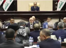  ?? AP ?? Iraqi prime minister Haider Al Abadi, centre, attends a session of parliament in Baghdad yesterday
