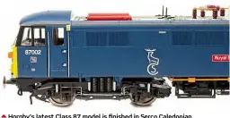  ??  ?? ↑ Hornby’s latest Class 87 model is finished in Serco Caledonian Sleeper blue with the stag logo as No. 87002 Royal Sovereign which was applied in 2015.