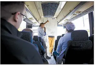  ?? Bloomberg/COLE BURSTON ?? Frank Santaguida, First Cobalt’s vice president of exploratio­n, uses a map to explain mining properties to investors, analysts and geologists touring company properties outside Cobalt, Ontario, last month.