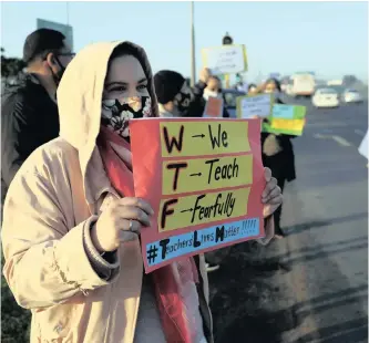  ??  ?? TEACHERS and concerned parents picket along Jakes Gerwel Drive in Cape Town yesterday against the reopening of schools. | HENK KRUGER African News Agency (ANA)