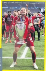  ??  ?? Fans would be alienated if clubs swapped Ol’ Big Ears for a Mickey Mouse exhibition tournament
GLORIOUS Liverpool’s Jordan Henderson lifts Champions League pot