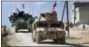  ?? AP FILE PHOTO ?? This Tuesday, March 7, 2017 frame grab from video provided by Arab 24 network, shows U.S. forces patrol on the outskirts of the Syrian town, Manbij, a flashpoint between Turkish troops and allied Syrian fighters and U.S.-backed Kurdish fighters, in...