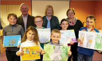  ??  ?? Front row: Ella Kelly 1st 7 and under from St Michael’s and St Peter’s school, Arklow and Oisin Howard 3rd U-9 Marymount school, the Rower. Middle row: Benjamin Blair 1st 8-10yrs Gorey Central school; Lily May O’Leary, Oylegate and Paudie Byrne 3rd U-9 special category from St Pat’s school. Back; Sean Furlong, Stella Kehoe and Ann St Ledger, New Ross Credit Union.