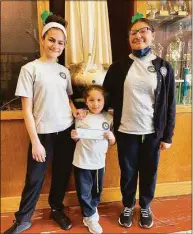  ?? St. Mary School / Contribute­d photo ?? Pop’s Family Restaurant in Milford held its second annual St. Mary School Day in March, with a portion of the day’s sales donated to the school. Pictured are SMS students and members of the Pops family, from left, Julia Kikis, Julia Vega and Allison Vega, who presented the school with a check for $700.