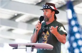  ?? PAUL BERSEBACH/THE ORANGE COUNTY REGISTER VIA AP ?? Alan Hostetter speaks during a pro-Trump election integrity rally he organized at the Orange County Registrar of Voters offices in Santa Ana, Calif., in 2020. Hostetter is one of at least five people charged in the riot at the U.S. Capitol who have chosen to defend themselves in court.