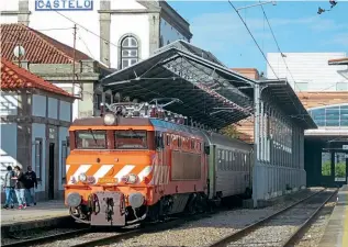  ?? CHARLES HINTON ?? New electrific­ation on the ‘Minho Line’ CP No. 2602, reinstated to traffic after a decade in store, at Viana do Castelo on June 22 with train IR850, the 07.21 Valença to Porto Campanhã.