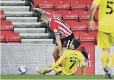  ??  ?? Max Power evades a tackle to drive Sunderland forward.