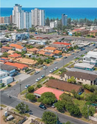  ??  ?? The Burleigh Heads property at 20 Deodar Drive (bottom corner block) sold under the hammer.