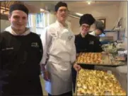  ?? PAUL POST — DIGITAL FIRST MEDIA ?? BOCES culinary students helped prepare large amounts of food for the Touched by An Angel fundraiser. From left are student John Thomas, BOCES culinary instructor Paul Cerone, and student Destiny Gardner.