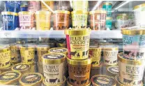  ?? Lynda M. Gonzalez / Associated Press ?? Various Blue Bell ice cream flavors fill several shelves at an H-E-B grocery store in Austin as the brand rebounds.