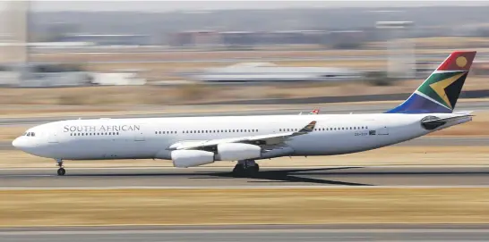  ?? Picture: Reuters ?? GROUNDED. A South African Airways Airbus A340-300 plane lands at OR Tambo Internatio­nal Airport before the national aviation strike, with talks between unions and SAA deadlocked.