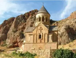  ?? NIRVA HACHERIAN FILE PHOTO FOR THE TORONTO STAR ?? Built of reddish stone and sitting in a gorge cut by the Amaghu river, the Noravank monastery in Armenia appears to be a site steeped in fascinatin­g melancholy, writes Noah Richler.
