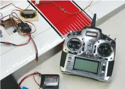  ??  ?? When an airplane uses dual ailerons concealed within the wing, it is often easier to program and verify functional­ity with the servos exposed. If each aileron servo is connected to a different receiver port, you can program the differenti­al.