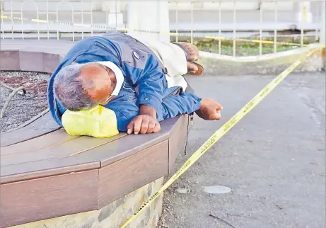  ?? Picture: ATU RASEA ?? A member of the public takes a nap at a cordoned off area in Suva yesterday.