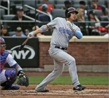  ?? FRANK FRANKLIN II — THE ASSOCIATED PRESS ?? Washington Nationals’ Jose Lobaton follows through on a home run in the second inning against the New York Mets on Saturday.