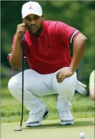  ?? STEVE HELBER — THE ASSOCIATED PRESS ?? Harold Varner III looks at a putt on the first hole during the third round of the Military Tribute at The Greenbrier golf tournament in White Sulphur Springs, W.Va., Saturday.