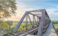  ??  ?? Stationed 50 feet above ground on the Selati Bridge, the luxe hotel overlooks the Sabie River in Kruger National Park.