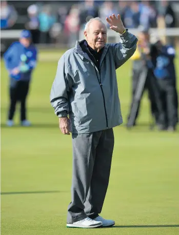  ?? KIRKGLYN KIRK/GETTY IMAGES FILES ?? Golf icon Arnold Palmer waves to fans on The Old Course at St Andrews, Scotland, in July 2015. Palmer died on Sunday at age 87 after a long period of declining health.
