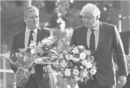  ?? ALBERTO PEZZALI/AP ?? Labour Party leader Keir Starmer, left, and British Prime Minister Boris Johnson arrive Saturday at the scene where David Amess was stabbed to death Friday.