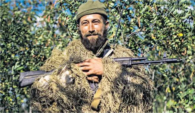  ?? ?? A Ukrainian soldier, known by his call sign Barman, on the front line near Mykolaiv