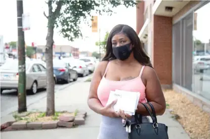  ?? ANTHONY VAZQUEZ/SUN-TIMES PHOTOS ?? Lashann Walker stands outside the Auburn Park Post Office on Tuesday in Auburn Gresham. She was retrieving her mail and said no mail has been delivered to her home for three weeks.