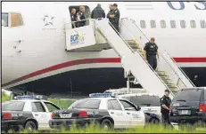  ?? KEVIN BENNETT / AP ?? A passenger jet was diverted to Bangor Internatio­nal Airport on Tuesday during its flight from France to Charlotte after a passenger caused a disturbanc­e.