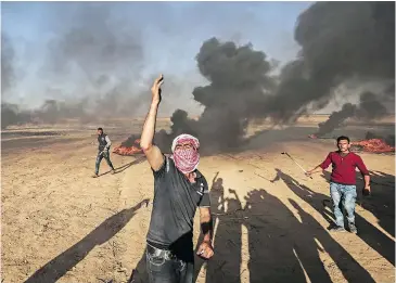  ?? — GETTY IMAGES ?? Clashes between Palestinia­n protesters and Israeli security forces have left 15 people dead and hundreds more wounded along the Gaza Strip border.