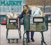  ?? Brian Cassella Chicago Tribune ?? INSTACART uses “shoppers,” who are classified as contractor­s, to fulfill grocery orders from customers.