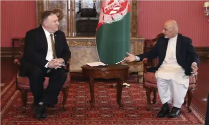  ??  ?? The US secretary of state, Mike Pompeo, meets the incumbent Afghan president, Ashraf Ghani, in Kabul on 23 March. Photograph: AP