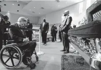  ?? Associated Press file photo ?? Gov. Greg Abbott passes by the casket of George Floyd during a public visitation for him last June at a Houston church.