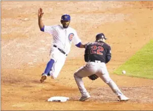  ?? EZRA SHAW/GETTY IMAGES/AFP ?? Dexter Fowler of the Chicago Cubs steals second base past Jason Kipnis of the Cleveland Indians in Game 5 of the 2016 World Series in Chicago, Illinois.