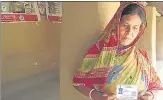  ?? HT PHOTO ?? Purnima Haldar holds her son Sanjib’s Aadhaar card, who died by suicide after he was separated from his wife.