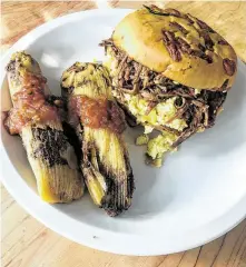  ?? J.C. Reid / Contributo­r ?? Brisket breakfast sandwich and tamales at Pappas Bar-B-Q