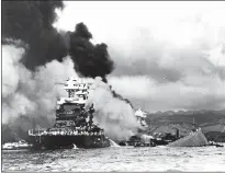  ?? PHOTO COURTESY OF THE NAVY HISTORY AND HERITAGE COMMAND ?? The USS Oklahoma, right, sank into the mud next to the USS Maryland in the attack on Pearl Harbor on Dec. 7, 1941. Albert Eugene Hayden of Mechanicsv­ille was one of 429 killed aboard the Oklahoma. Hayden’s remains are returning for burial in St. Mary’s...