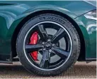  ??  ?? Five-spoke 19in wheels, painted gloss black, are a tribute to the Torq Thrust rims of the Mustang GT390 Fastback of Bullitt movie stardom and of countless American customs and hot rods since.