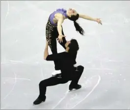  ?? AHN YOUNG-JOON, THE ASSOCIATED PRESS ?? Tessa Virtue and Scott Moir from Canada perform in the ice dance short dance program in Gangneung, South Korea, Thursday.