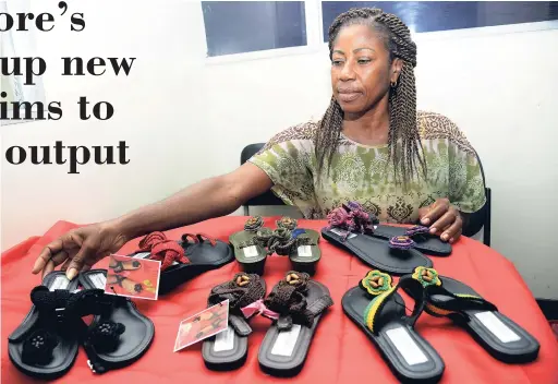  ?? Norman Grindley/Chief Photo Editor ?? Marlene Moore shows off crocheted footwear made by her company, Lynmoore’s Unique Crocheted Sandals.