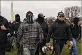  ?? CAROLYN KASTER — THE ASSOCIATED PRESS ?? Proud Boy members Joseph Biggs, left, and Ethan Nordean, right with a megaphone, walk toward the U.S. Capitol in Washington in support of President Donald Trump on Jan. 6.