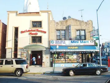  ??  ?? In a span of mere blocks in the Little Guyana neighbourh­ood of Queens, New York, you’ll find a Shri Lakshmi Narayan Mandir Hindu temple, above, a Pentecosta­l church and an Islamic clothing store.