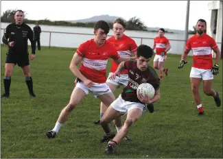 ??  ?? Dingle (in red and white) won the Senior Men’s competitio­n by beating County Laois’s Portarling­ton in the final.