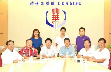  ??  ?? Ing Ang (seated right), UCA Sibu division president Ngieng Ping Sing (seated third left), deputy treasurer Yong King Sung (seated left) and others pose for a group photo.