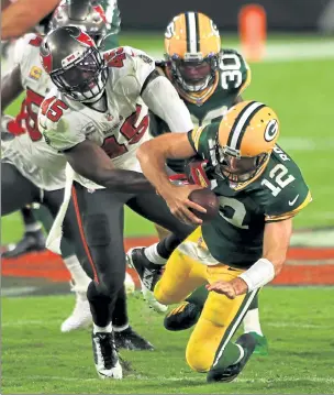  ?? GETTY IMAGES ?? Tampa Bay Buccaneers inside linebacker Devin White sacks Green Bay Packers quarterbac­k Aaron Rodgers during the second half of Sunday’s game in Tampa, Fla.