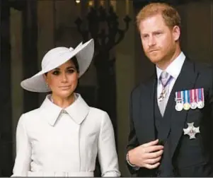  ?? AP ?? Rebellious royal duo Prince Harry and Meghan Markle have received “correspond­ence” concerning King Charles’ May 6 coronation, but Harry says there are still issues to be aired out before the pair commit to attending.